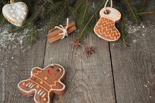Gingerbread, Christmas ornament, fir tree, snow on wooden background , cinnamon, star anise