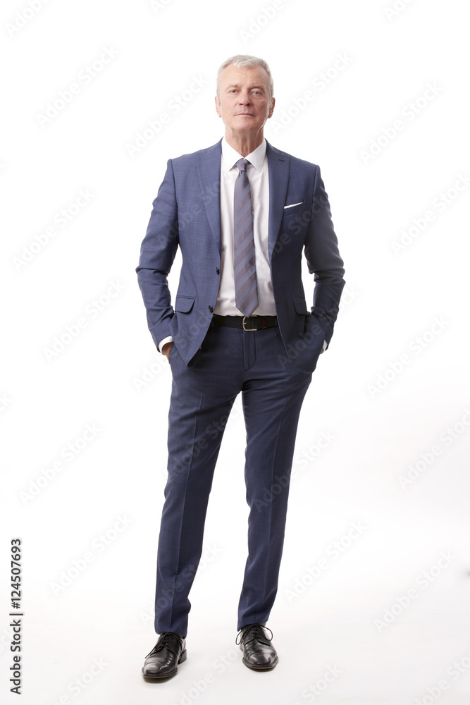Old businessman portrait.Full length shot of a senior manager standing in suit at isolated white background. Old businessman portrait.Full length shot of a senior manager standing in suit at isolated white background.