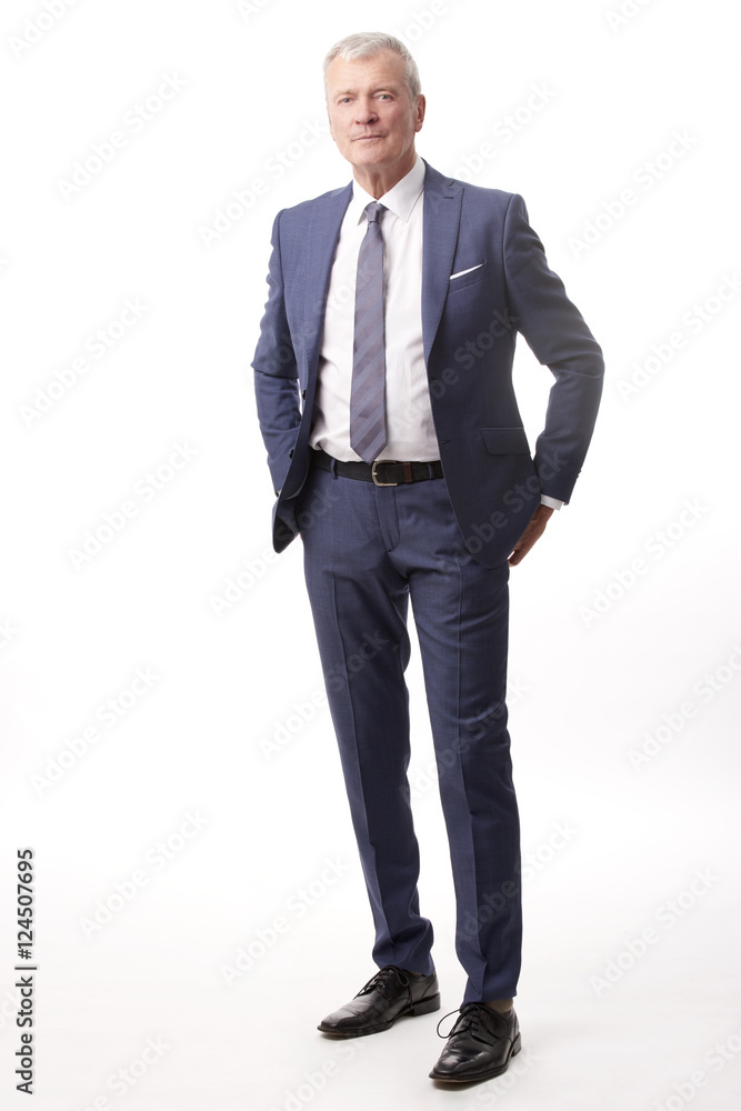 Old businessman portrait.Full length shot of a senior manager standing in suit at isolated white background. Old businessman portrait.Full length shot of a senior manager standing in suit at isolated white background.