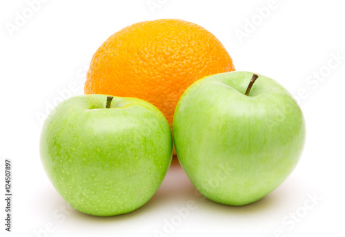 Ripe green apples with orange fruit isolated on white