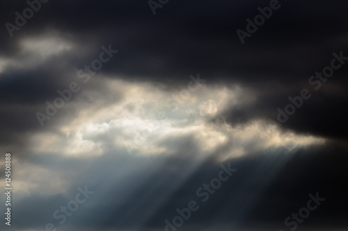 a beam of light from a dark sky