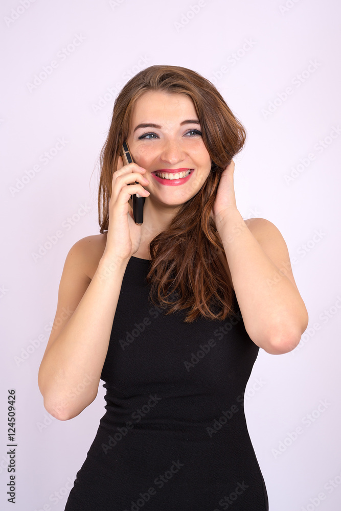 Beautiful smiling business woman have an emotion talking on the phone Beautiful smiling business woman have an emotion talking on the phone