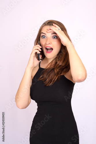 Beautiful smiling business woman have an emotion talking on the phone