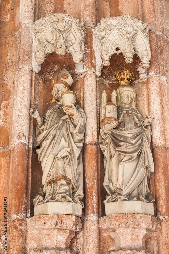 Statues of  Saint Rupert - the founder of Nonnberg Abbey,  and his niece Saint Erentrude -  the first abbess of Nonnberg Abbey. Portal of the collegiate church of Nonnberg Abbey.