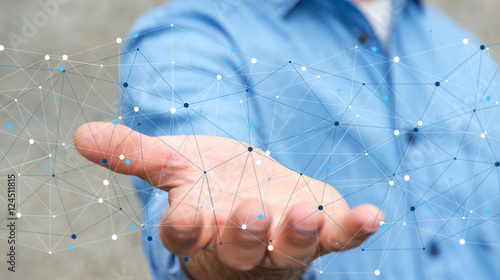 Foto Businessman holding digital data network in his hand