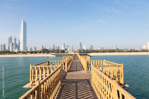 Wooden Pier and Skyline of Kuwait City photo