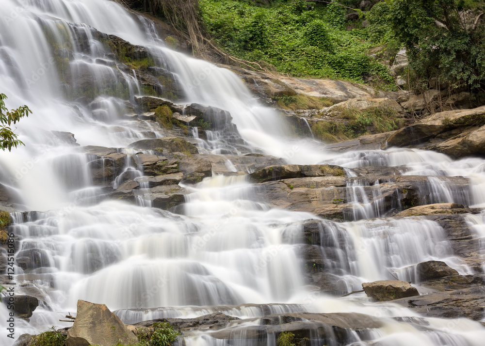Fototapeta premium Mae Yah Waterfall, beautiful waterfall in autumn forest, Chiang Mai province, Thailand