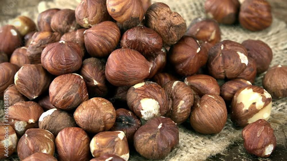Portion of rotating Hazelnuts (seamless loopable) as 4K UHD footage Portion of rotating Hazelnuts (seamless loopable) as 4K UHD footage