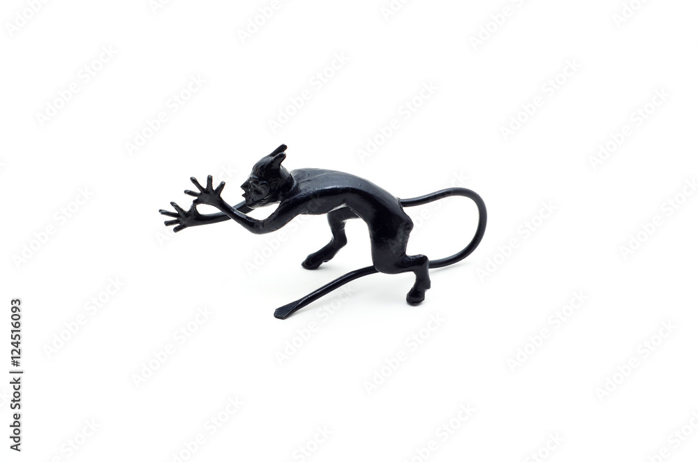 Fototapeta premium Metal devil figurine in a sneering posture isolated on white background.