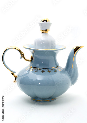 Porcelain teapot with a pattern of gold isolated on white background.