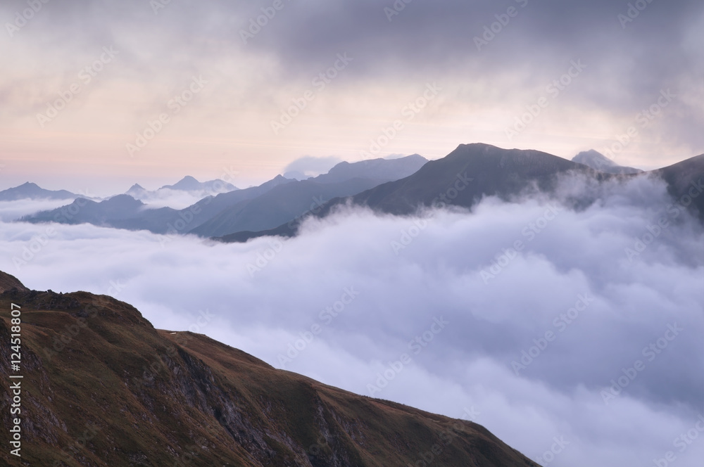 mountain range in morning fog