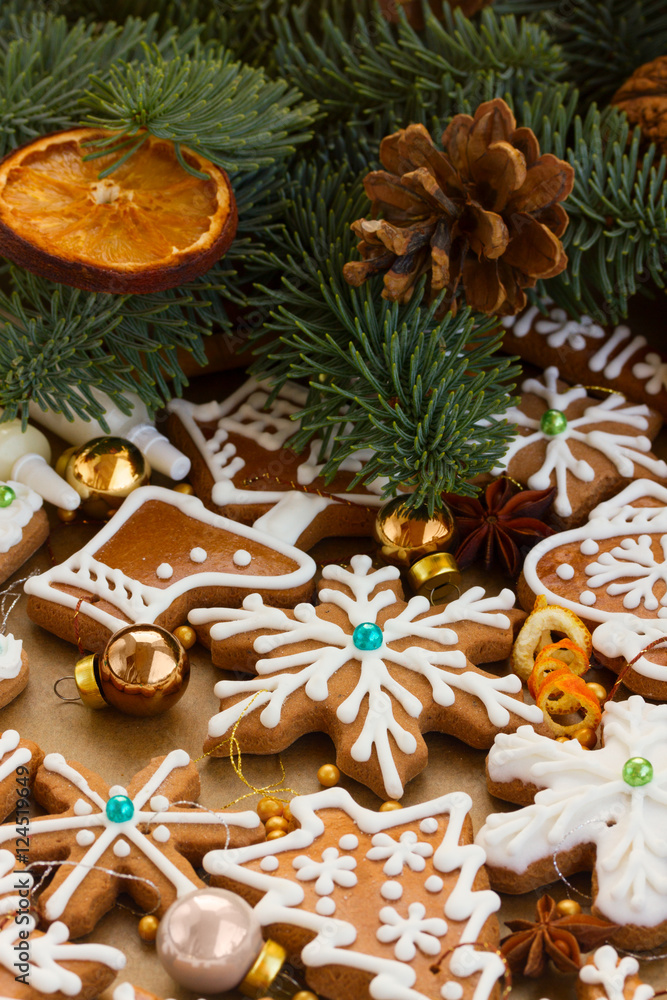 christmas gingerbread cookies with christmas decorations and fir tree - christmas traditional food