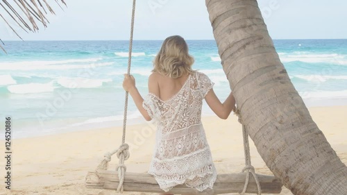 Beautiful and sexy woman resting seaside photo