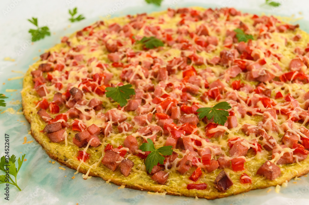Pizza - the basis of zucchini, ham and paprika. Healthy food. The top view