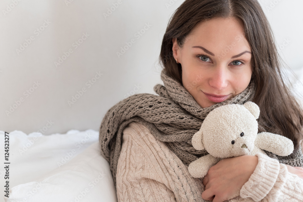 Joyful positive woman hugging a teddy bear Joyful positive woman hugging a teddy bear