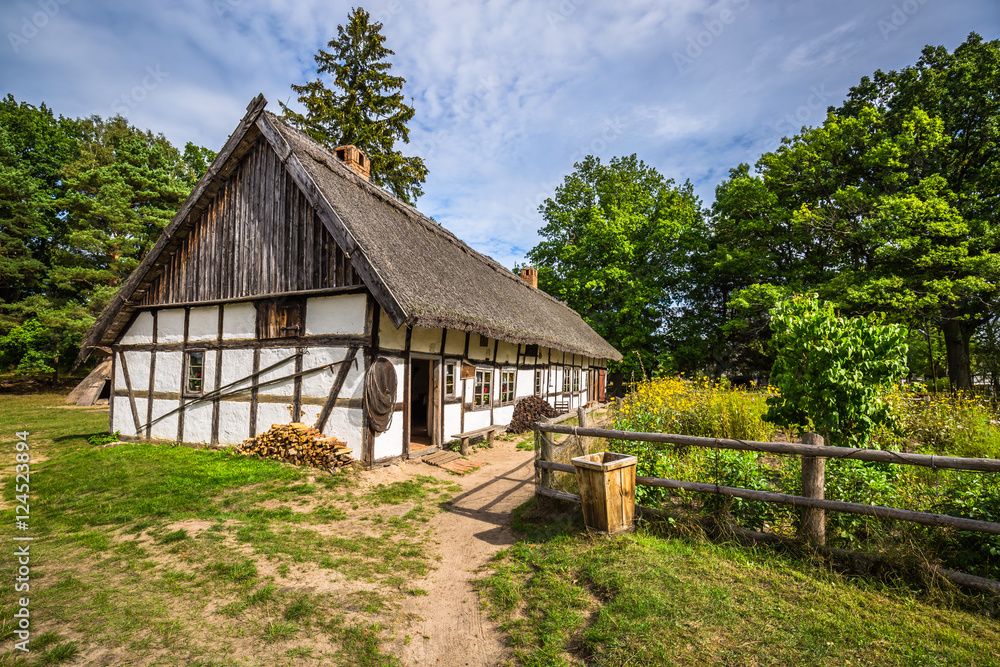 Old wooden house in Kluki, Poland - obrazy, fototapety, plakaty 