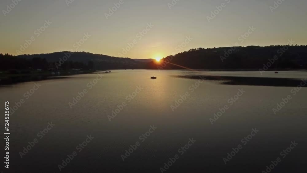 Aerial of a lake during the sunset. This is a 4k footage. Aerial of a lake during the sunset. This is a 4k footage.