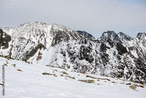 mountain tops in winter covered in snow © Martins Vanags