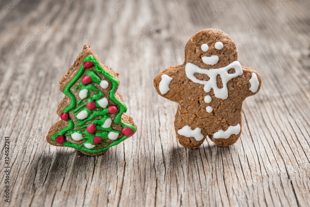 Gingerman and Christmas tree made of gingerbread dough as backgorund Gingerman and Christmas tree made of gingerbread dough as backgorund