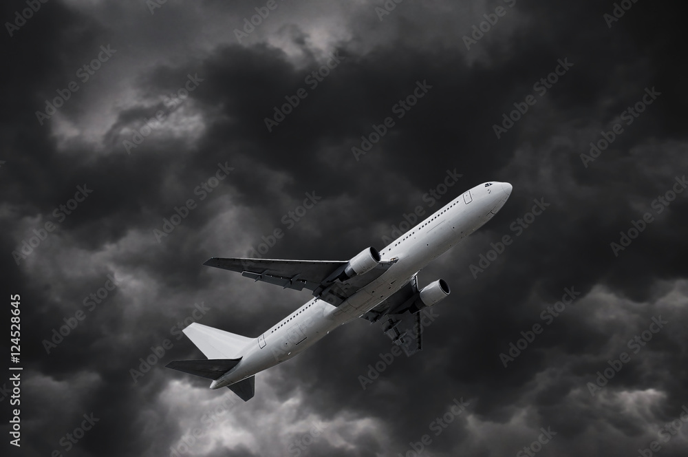 airplane on stormy sky