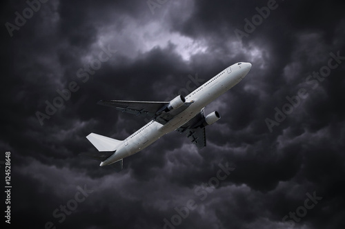 airplane under stormy sky