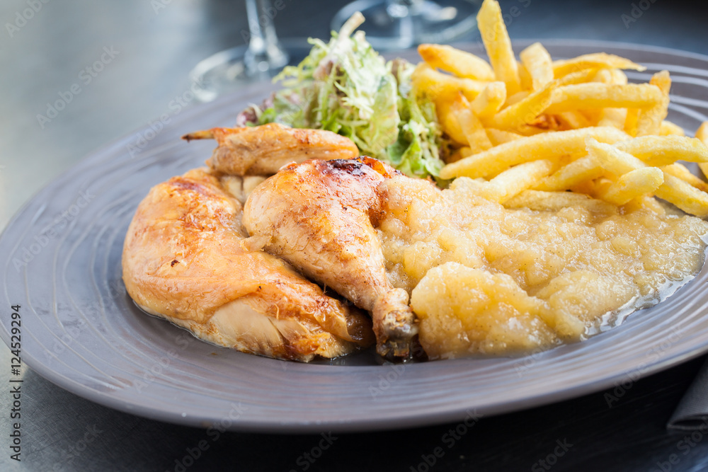 Fried chicken, apple sauce and french fries Fried chicken, apple sauce and french fries