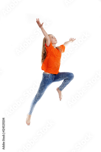 Young Girl with Blond Hair Jumping in the Air