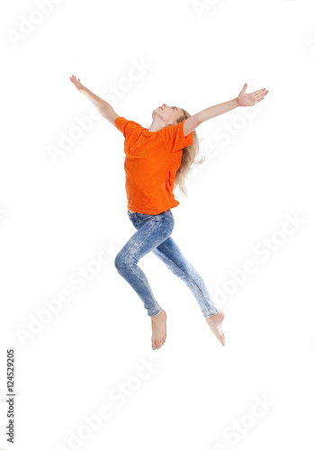 Young Girl with Blond Hair Jumping in the Air