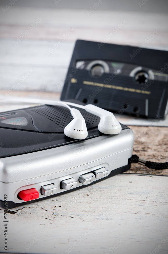 Old casette tape player and recorder with earphones Old casette tape player and recorder with earphones