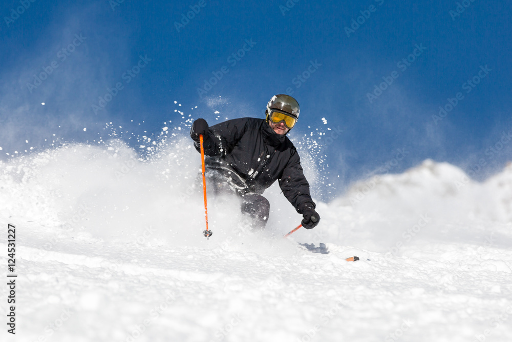 Male skier skiing at ski resort