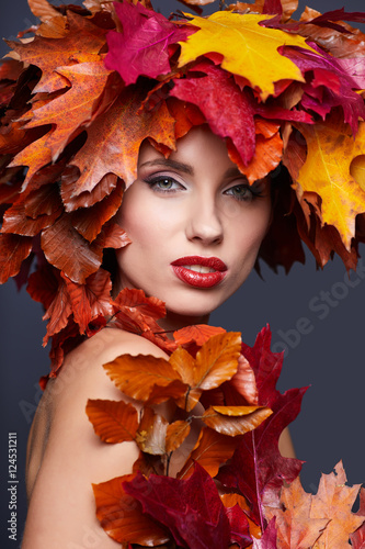 Woman with leafs on head in autumn concept. © ZoomTeam