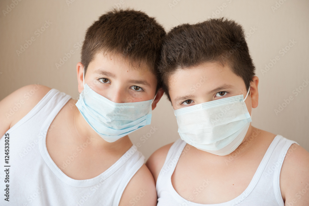two positive boys in medical masks