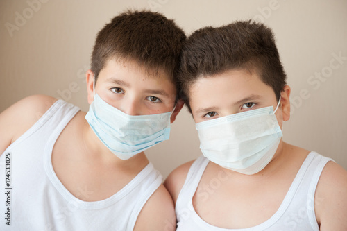 two positive boys in medical masks