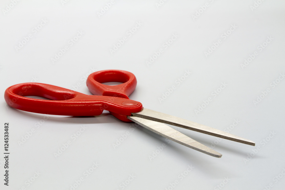 Scissors red on white table Scissors red on white table