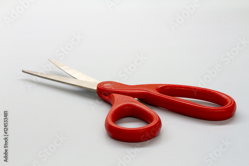 Scissors red on white table