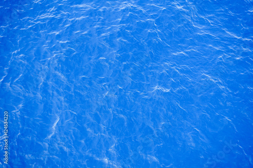 Flowing water surface of blue sea.