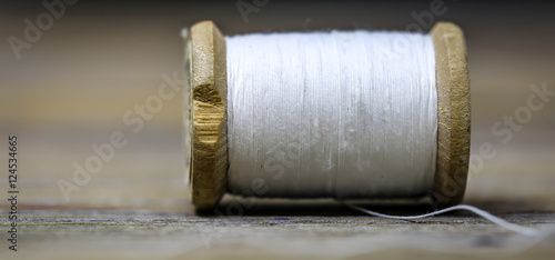 Sewing thread white color with a needle