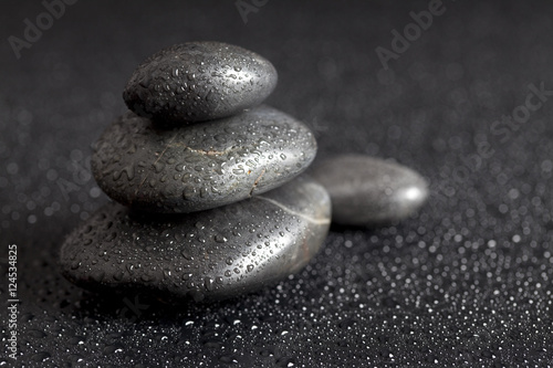 Dewy stones on black background