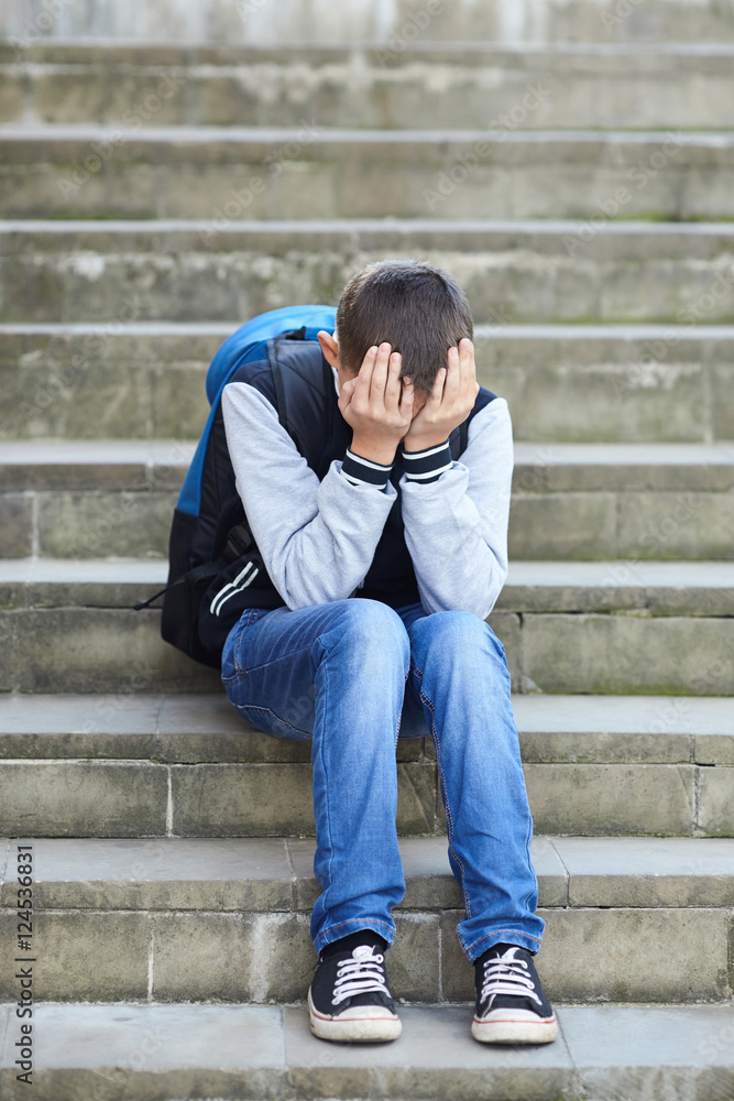 schoolboy crying on the street schoolboy crying on the street