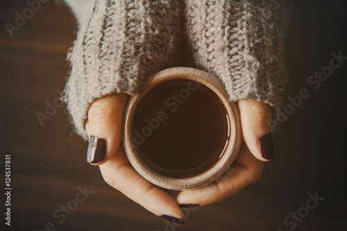 Girl holding a cup of tea