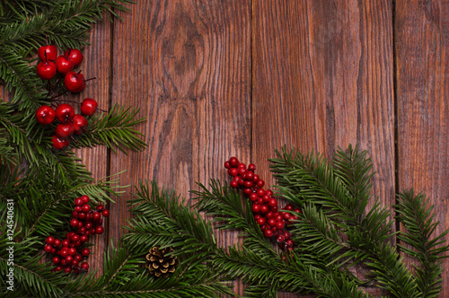 Christmas fir tree on wooden background