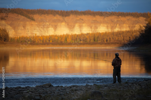 Evening fishing on the Siberian river autumn