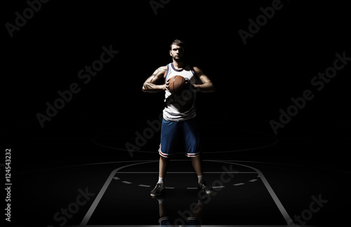 Young man basketball player with ball in studio isolated