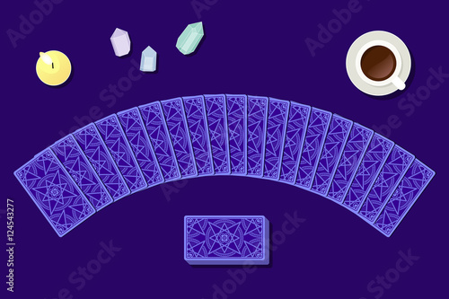 Tarot cards by reverse side laying in a semicircle on fortuneteller table. Above view. Witch working place