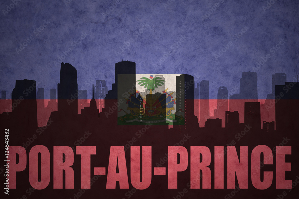 abstract silhouette of the city with text Port-au-Prince at the vintage haitian flag
