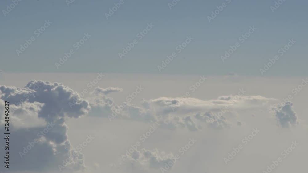 White Puffy Clouds, shot from photo plane with open window. NO plastic, just camera and sky. White Puffy Clouds, shot from photo plane with open window. NO plastic, just camera and sky.