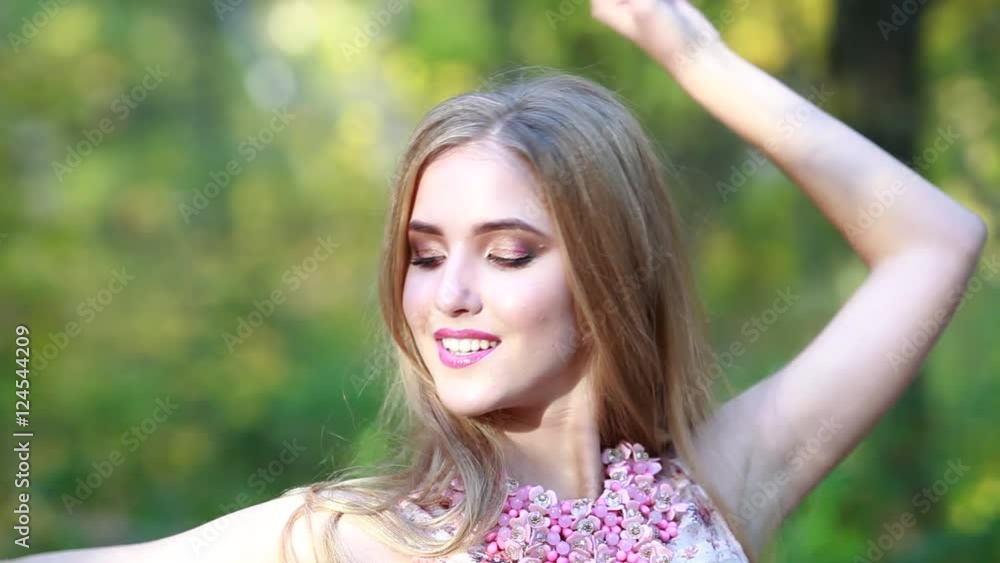 Portrait of a beautiful young girl with long hair on nature Happy Portrait of a beautiful young girl with long hair on nature Happy