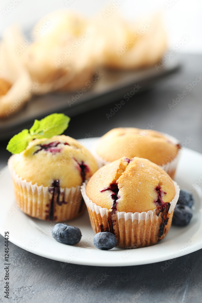 Muffins with blueberries on a grey table Muffins with blueberries on a grey table