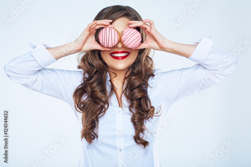 Fototapeta Smiling woman holding cake close up portrait.