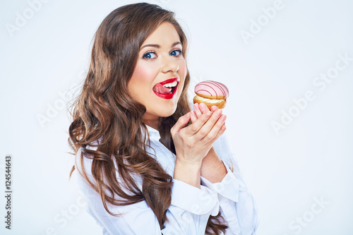 Woman licked lips with cake.